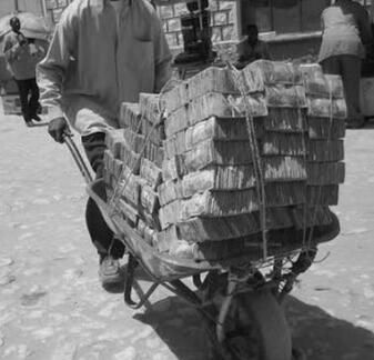 1923-24: A German woman feeds currency into a wood-burning stove because it burns longer than the firewood it could purchase.